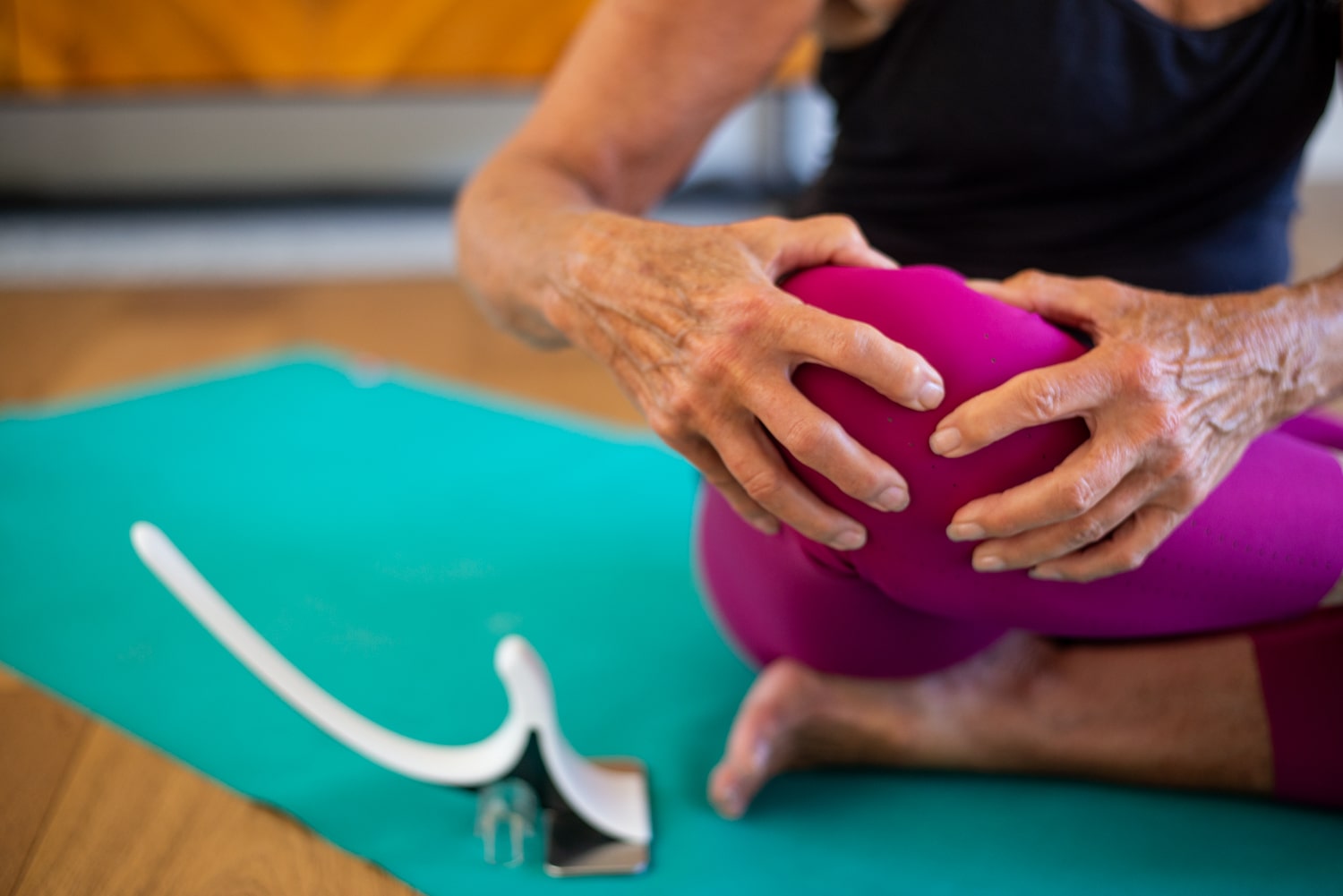 woman holding knee